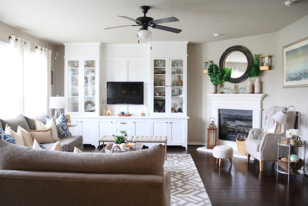 Living Room Decorated for Summer with a Palm/Coastal Vibe 