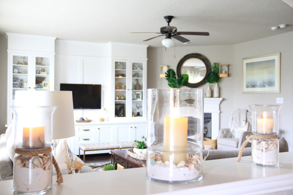 Living Room Decorated for Summer with a Palm/Coastal Vibe 