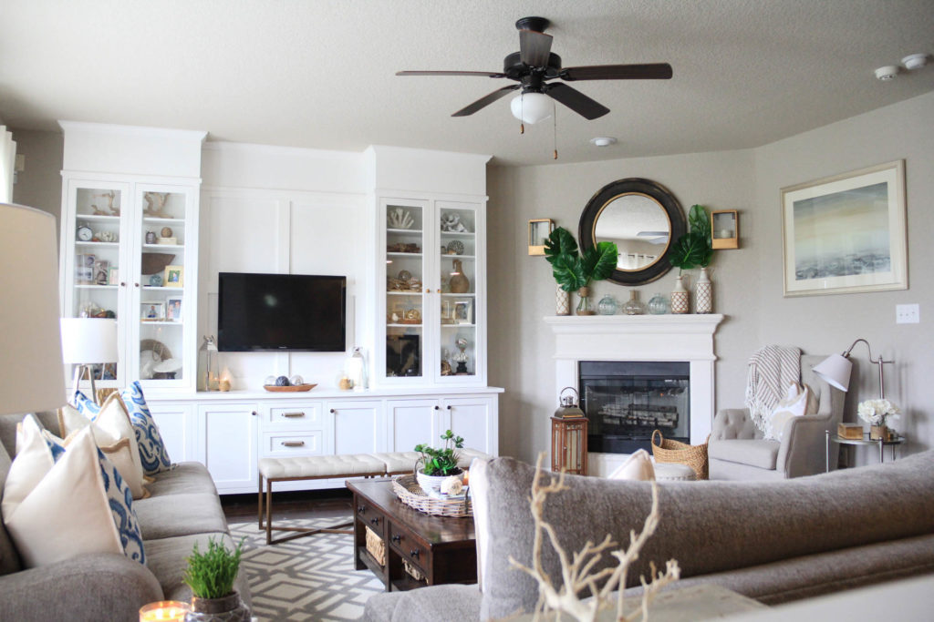 Living Room Decorated for Summer with a Palm/Coastal Vibe 