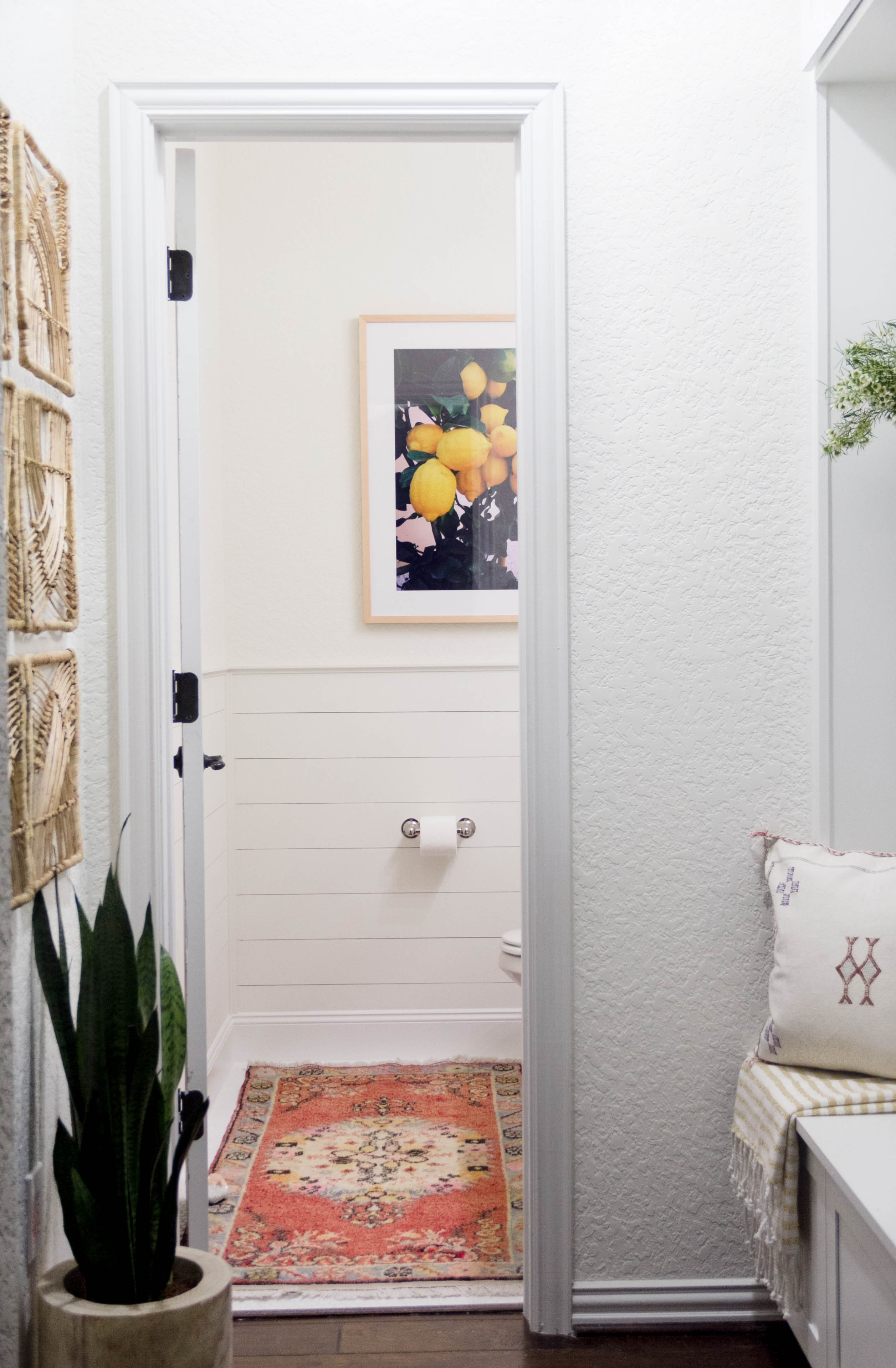 A bright and welcoming mudroom/powder room combo with a modern-casual-beach feel. Designed by: IrisNacole.com
