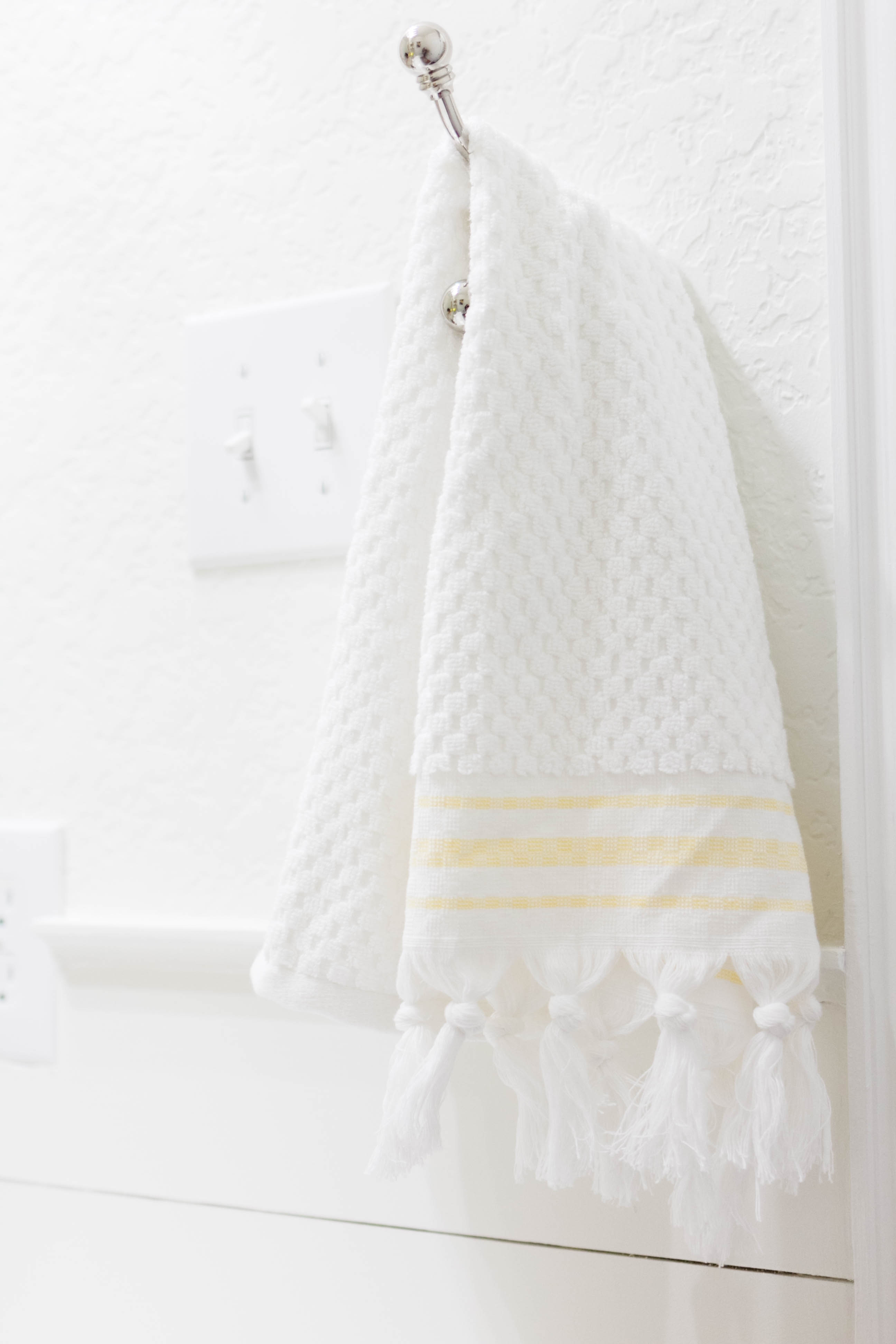 Hand Towel in a bright and welcoming mudroom/powder room combo with a modern-casual-beach feel. Designed by: IrisNacole.com