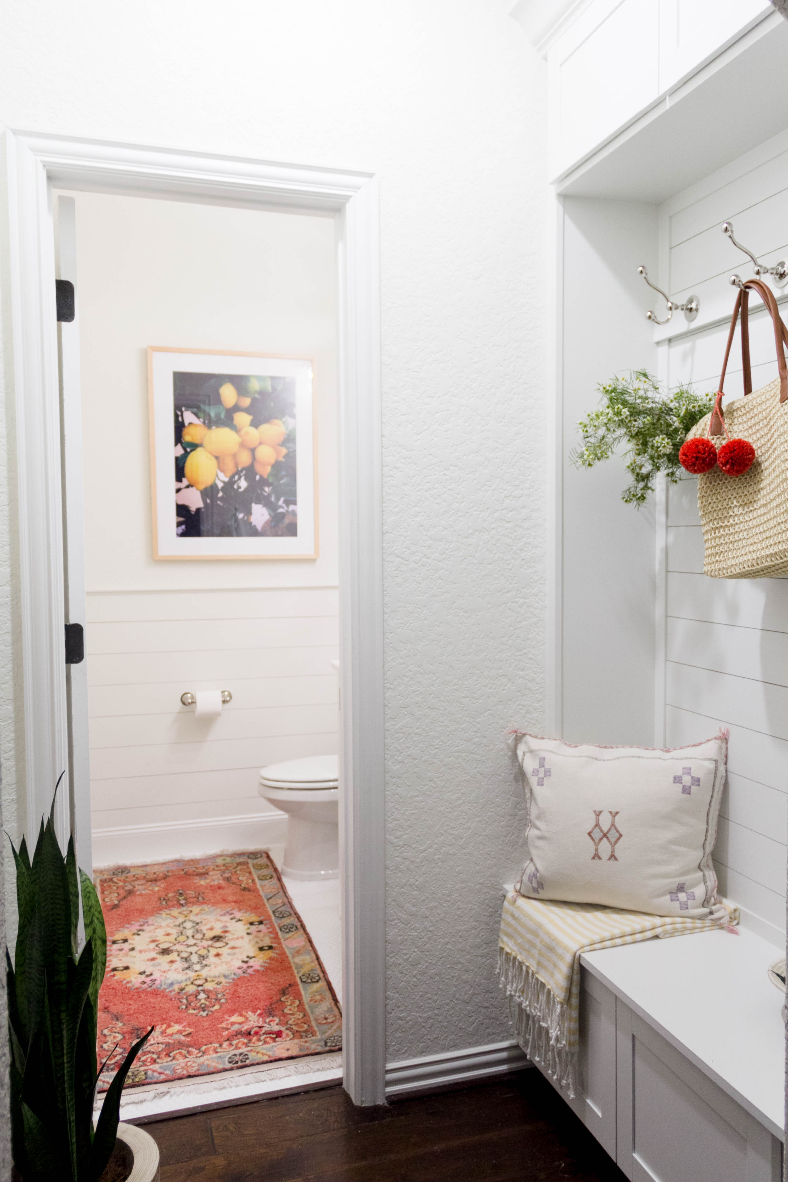 A bright and welcoming mudroom/powder room combo with a modern-casual-beach feel. Designed by: IrisNacole.com