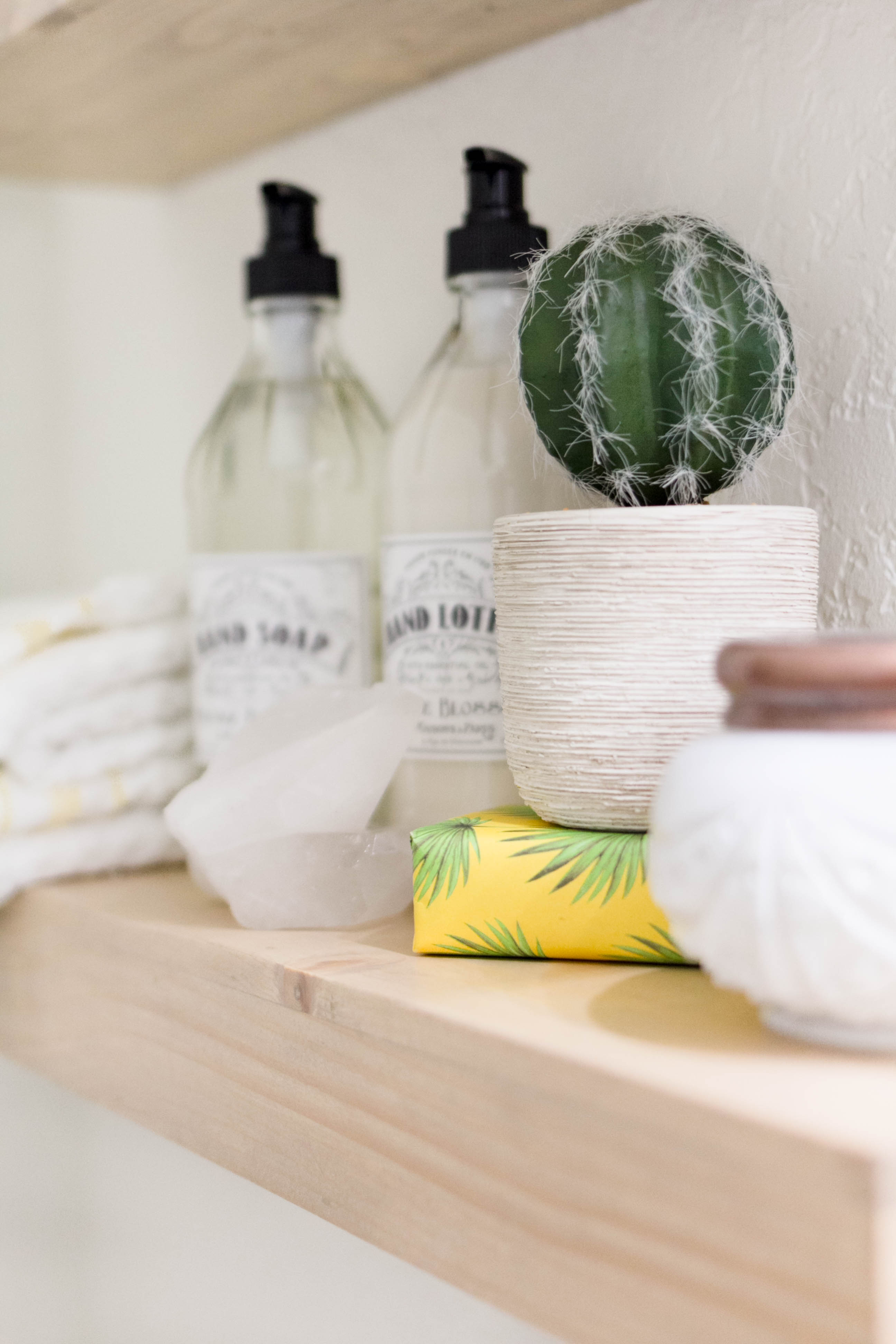 Floating Shelf Styling in a bright and welcoming mudroom/powder room combo with a modern-casual-beach feel. Designed by: IrisNacole.com