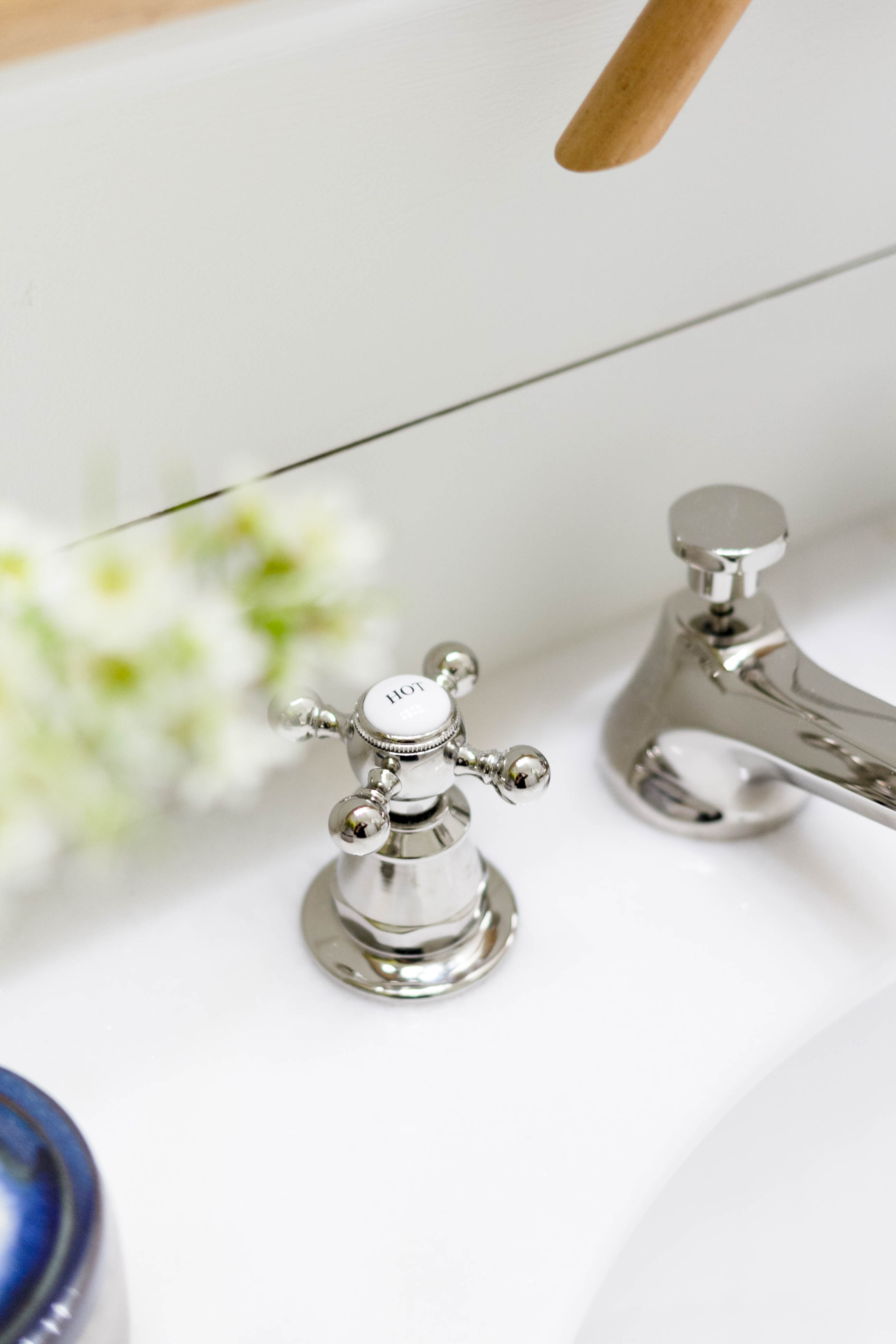 Sink Faucet n a bright and welcoming mudroom/powder room combo with a modern-casual-beach feel. Designed by: IrisNacole.com