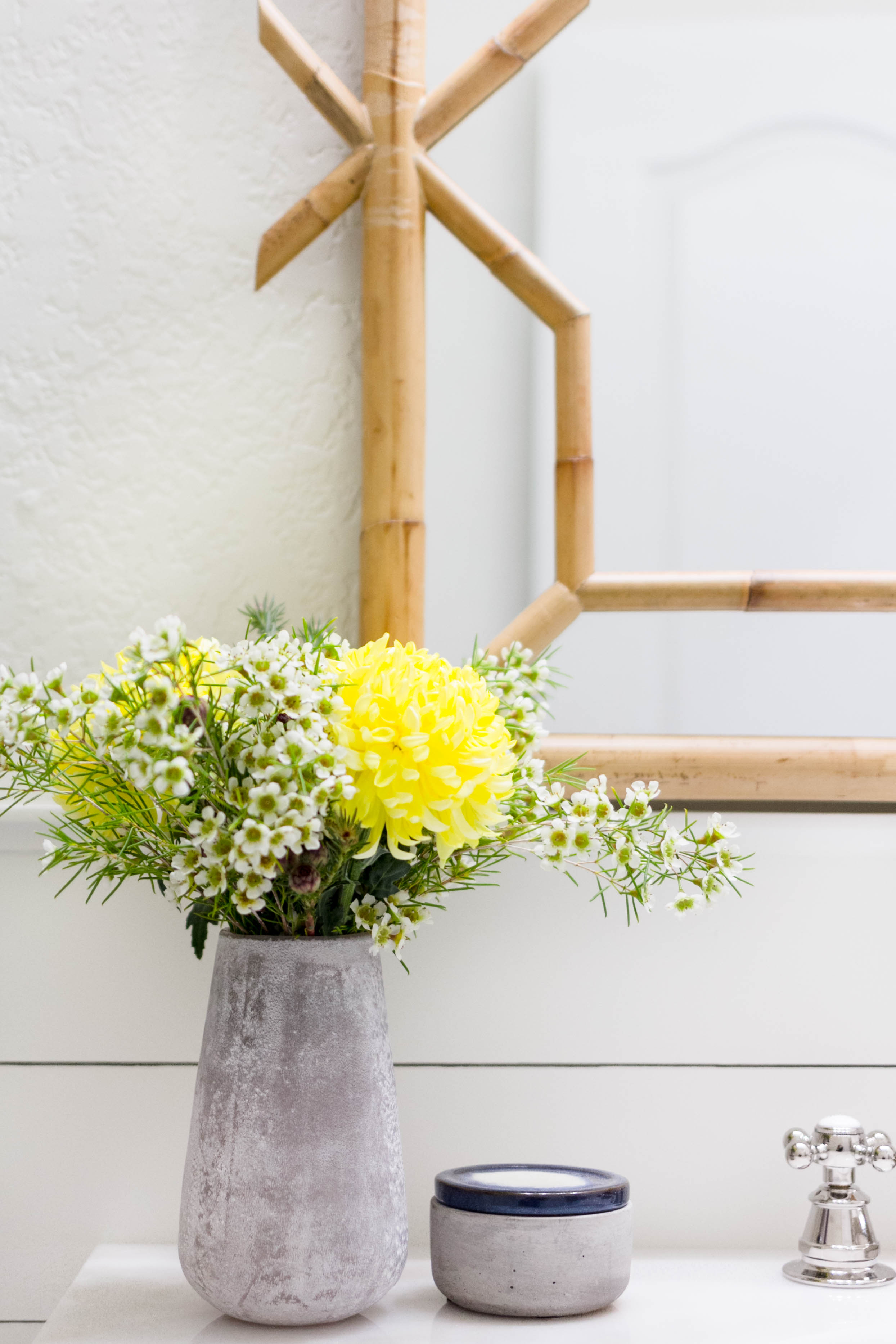 Floral arrangement Vanity Styling in a bright and welcoming mudroom/powder room combo with a modern-casual-beach feel. Designed by: IrisNacole.com