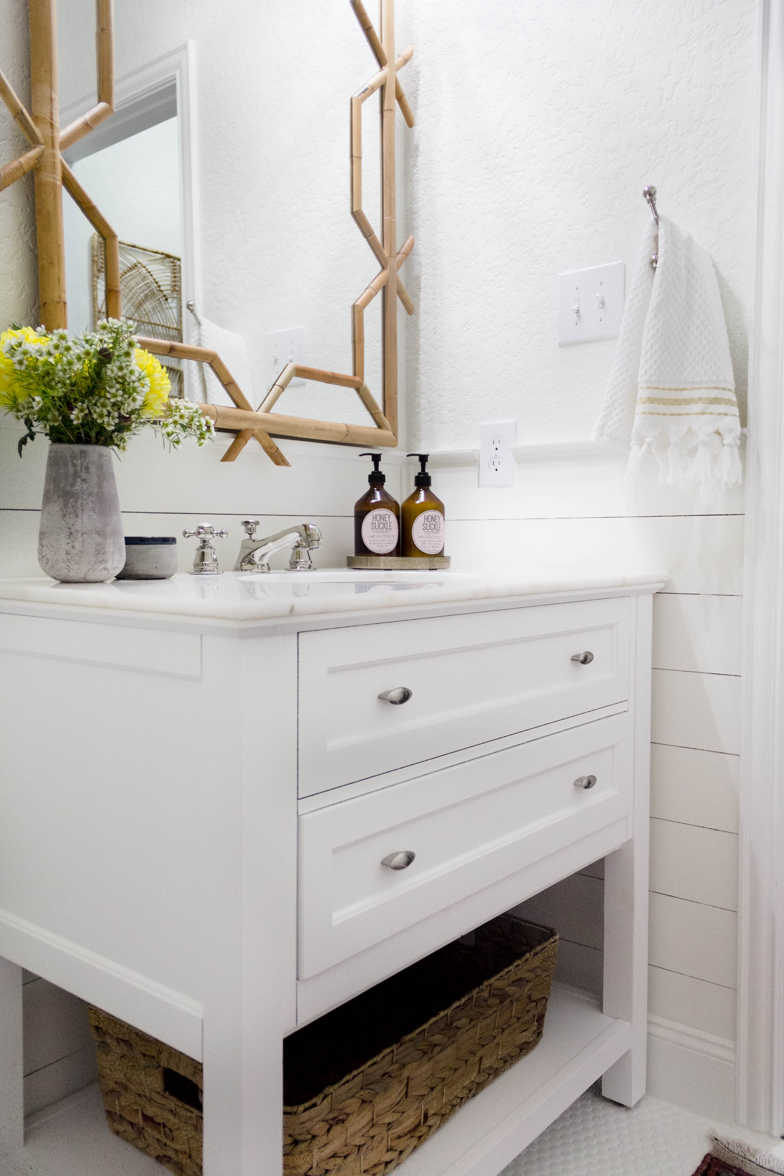 White vanity in a bright and welcoming mudroom/powder room combo with a modern-casual-beach feel. Designed by: IrisNacole.com