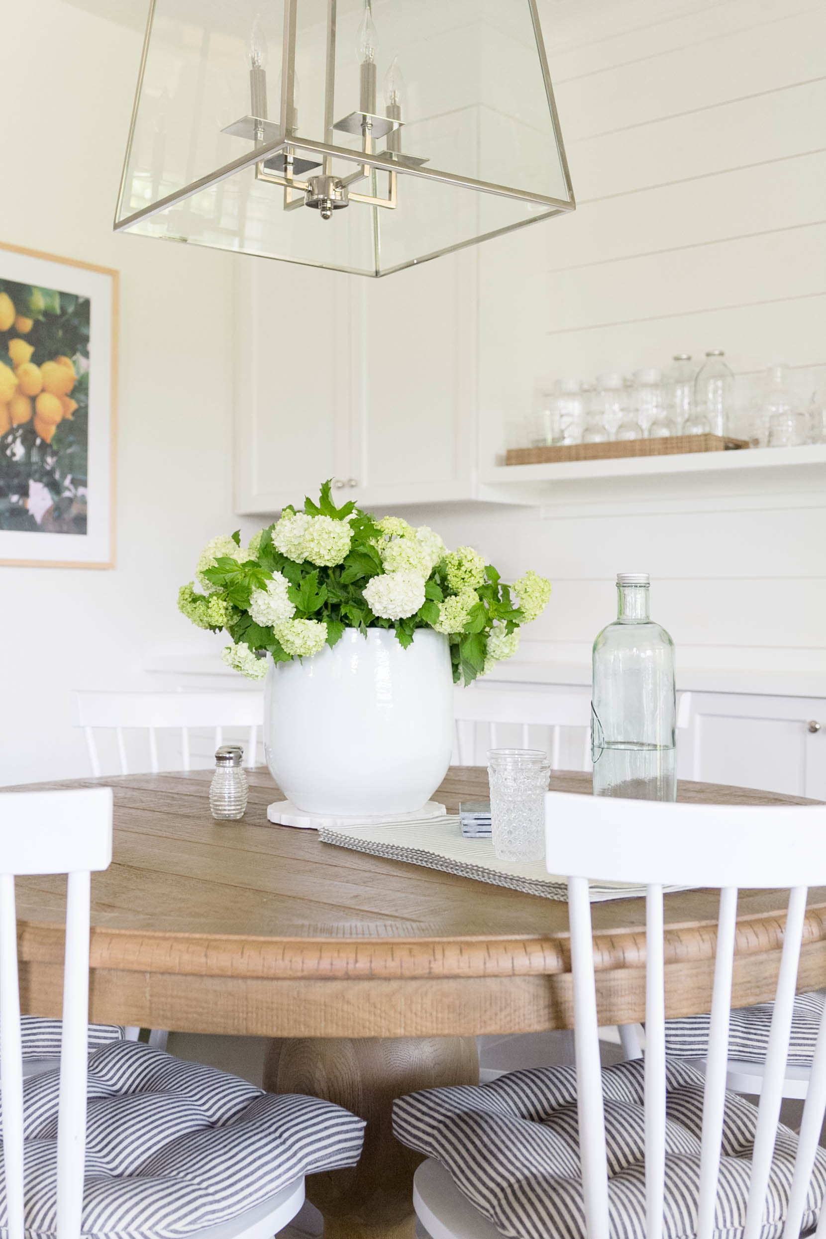 Transitional Dining Room-White built-in, vintage art, shiplap. Design and Styling by Iris Nacole