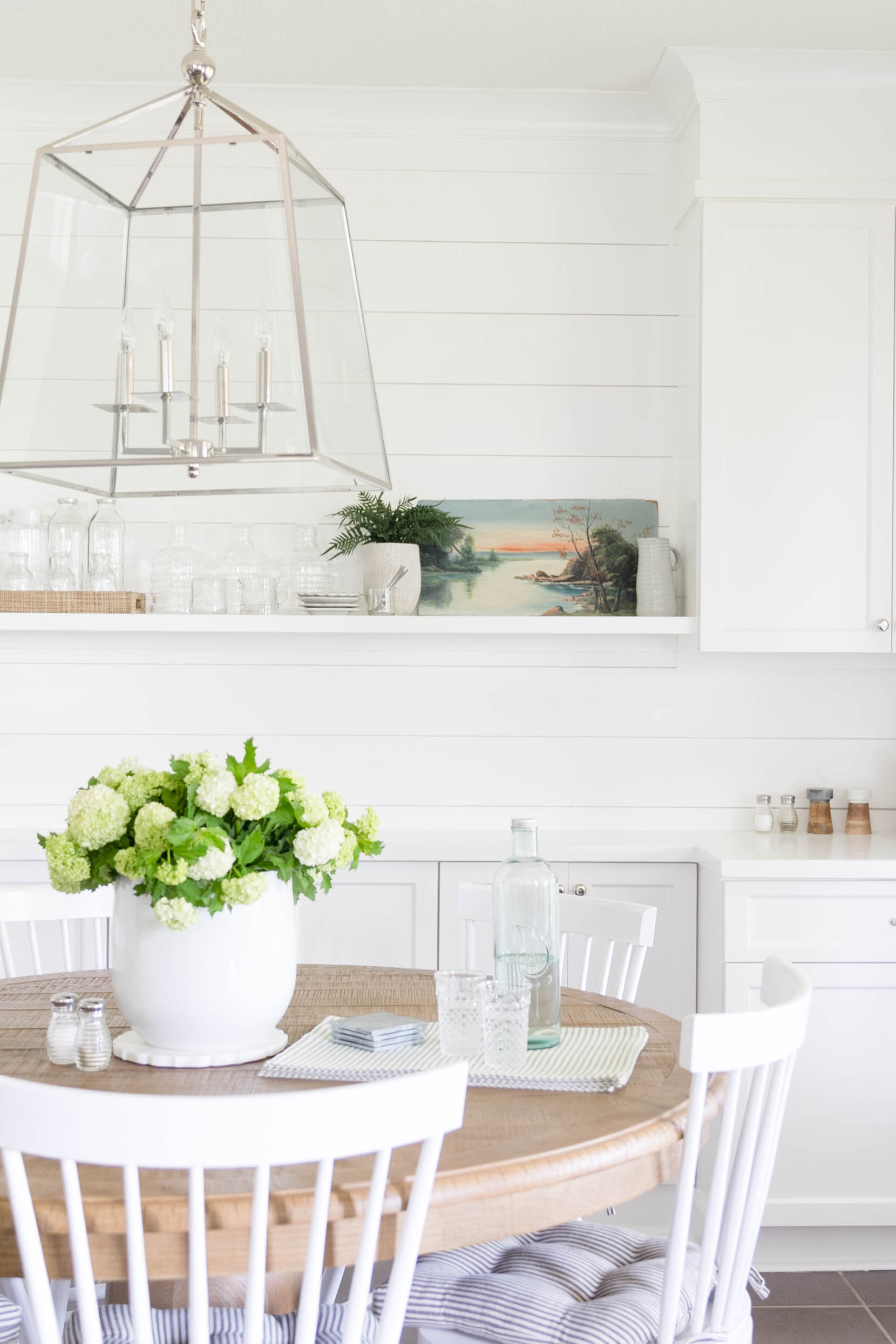 Transitional Dining Room-White built-in, vintage art, shiplap. Design and Styling by Iris Nacole