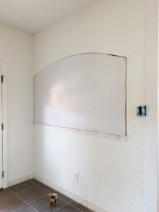 Closing up a half wall with drywall and shiplap.