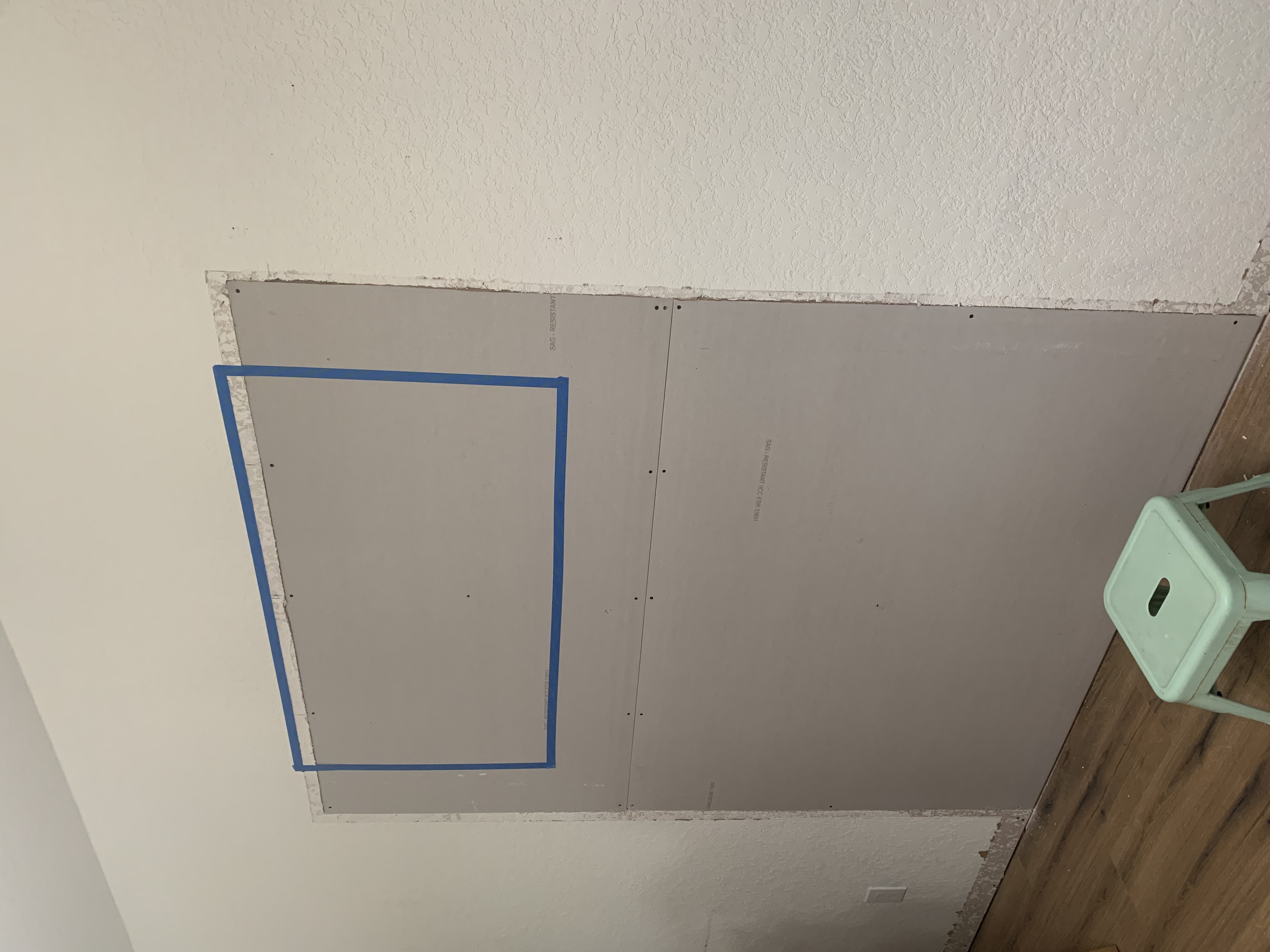 drywalling and closing up an opening on a wall