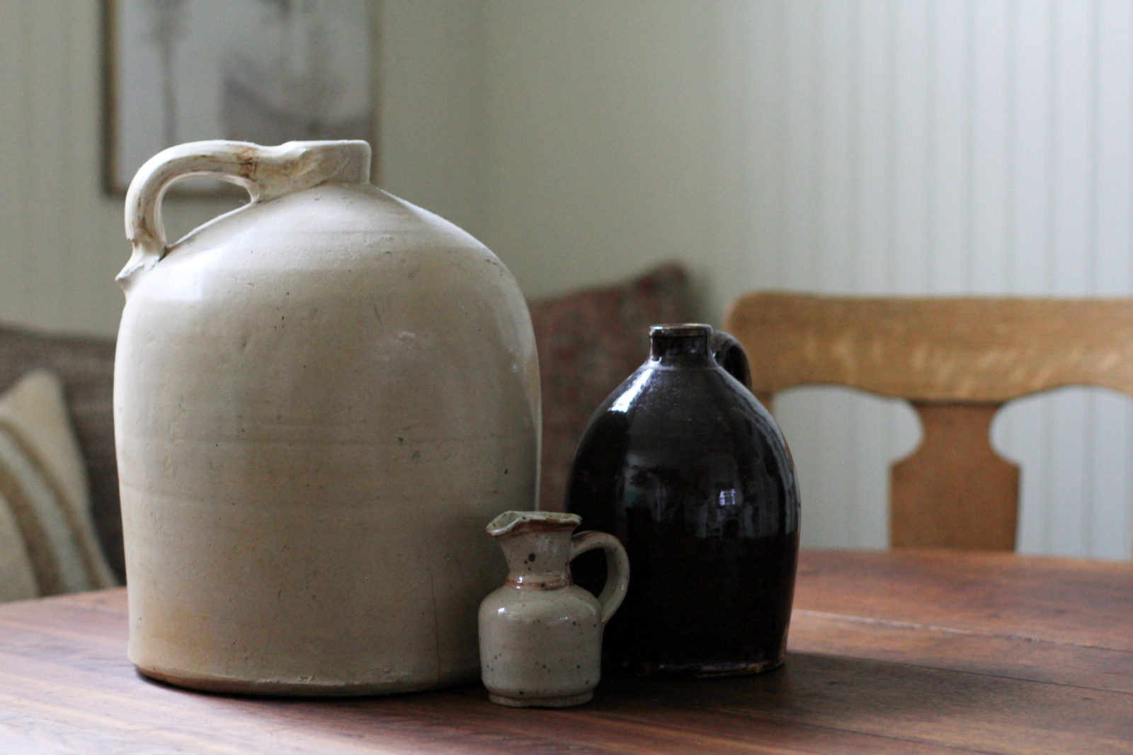 Vintage jugs styled on a vintage wooden dropleaf table.