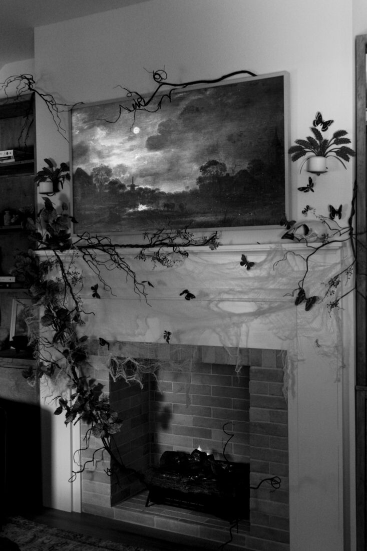 Fireplace decorated for Halloween-Spooky overgrown interior Halloween scene.